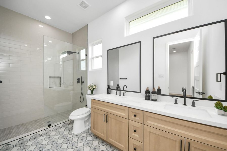 Secondary bathroom w/ large shower & dual vanites, natural light. Secondary bathroom w/ large shower & dual vanites, natural light.