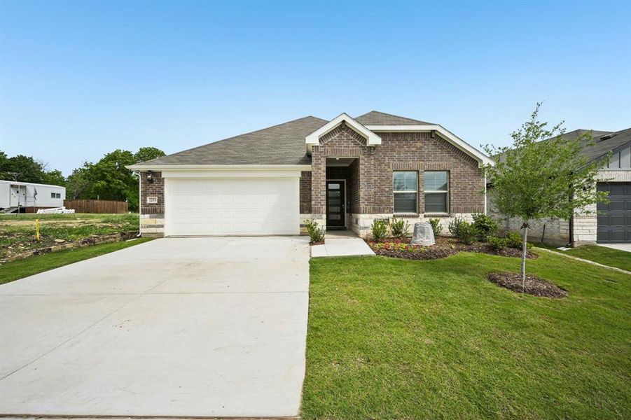 Front exterior of a new home in Westmoor, Sherman, TX, highlighting curb appeal (Image 1). Front exterior of a new home in Westmoor, Sherman, TX, highlighting curb appeal (Image 1).