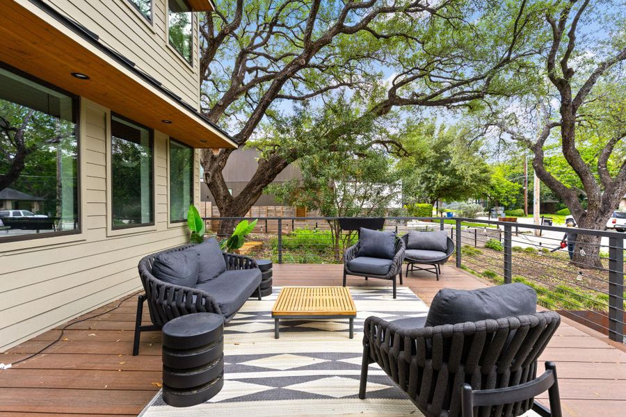 An inviting outdoor living space features a spacious wood deck, perfect for relaxation and enjoying the natural surroundings. An inviting outdoor living space features a spacious wood deck, perfect for relaxation and enjoying the natural surroundings.