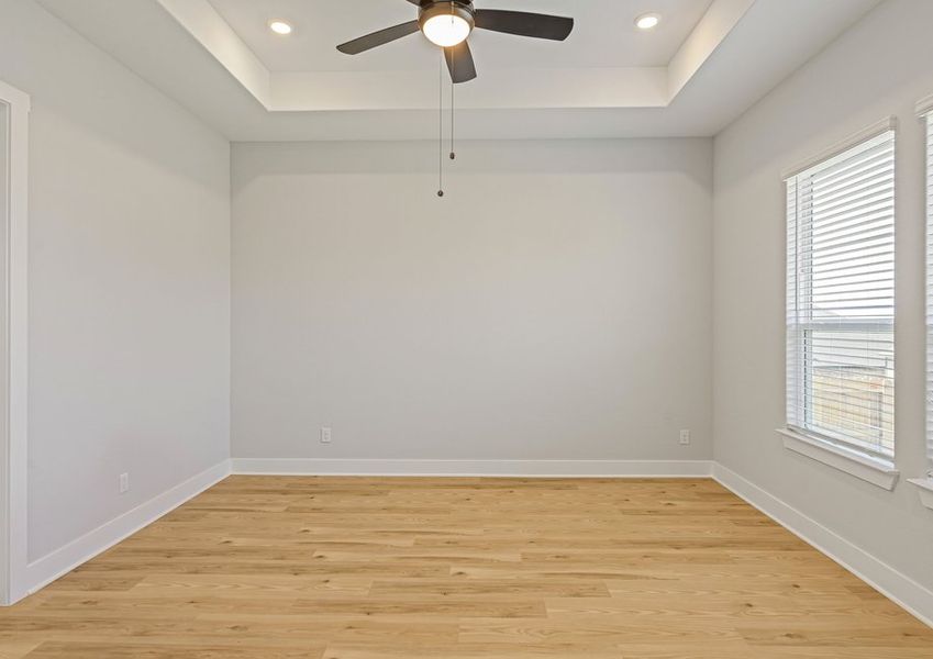 The master bedroom is spacious and has plenty of space for king-sized furniture.