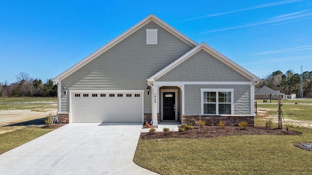 Representative exterior photo of a completed home built from the Capri IV by Epcon Communities in Courtyards by Carrell, Ocean Isle Beach, NC (Image 28). Representative exterior photo of a completed home built from the Capri IV by Epcon Communities in Courtyards by Carrell, Ocean Isle Beach, NC (Image 28).