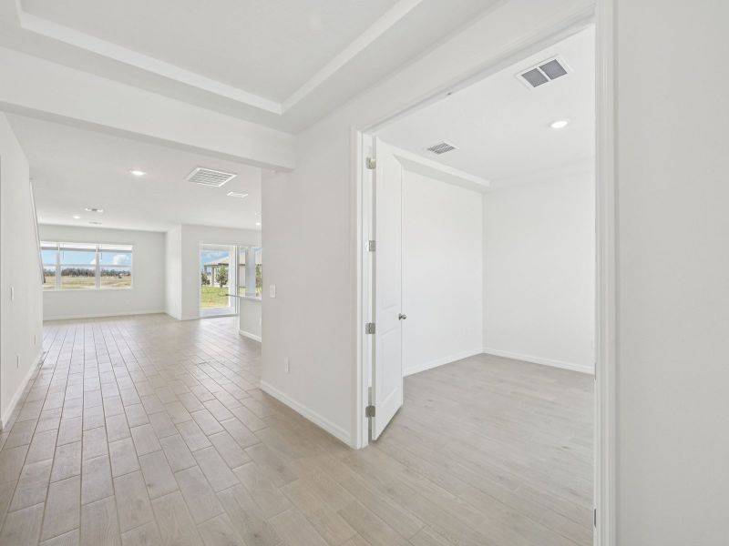 Spacious, unfurnished interior of a new home in Coasterra - Reserve Series, Palmetto (Image 12).