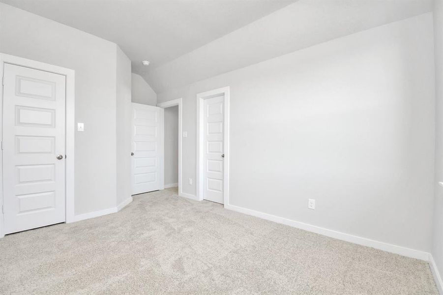 Generously sized secondary bedrooms featuring spacious closets, soft and inviting carpeting underfoot, large windows allowing plenty of natural light, and the added touch of privacy blinds for your personal retreat.