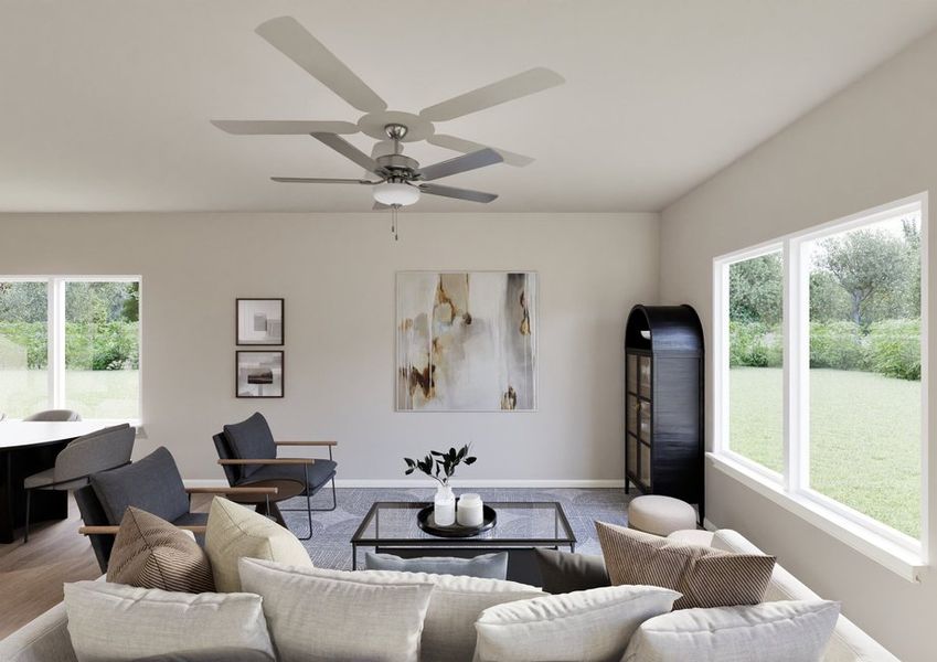 Modern living room with neutral tones, featuring a beige sofa, framed artwork, ceiling fan, and large windows showcasing a lush garden view. Calm ambiance. Modern living room with neutral tones, featuring a beige sofa, framed artwork, ceiling fan, and large windows showcasing a lush garden view. Calm ambiance.