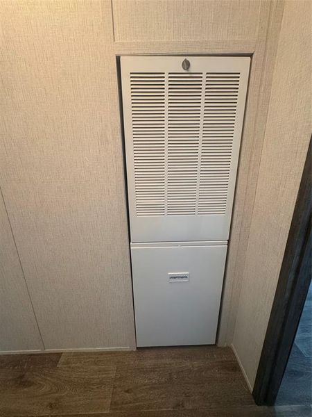 Detailed view of a heating unit and wood finished floors Detailed view of a heating unit and wood finished floors