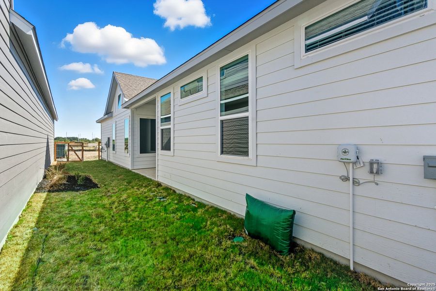 Exterior details and patio area of a home in The Crossvine – Garden Homes, Schertz (Image 1).
