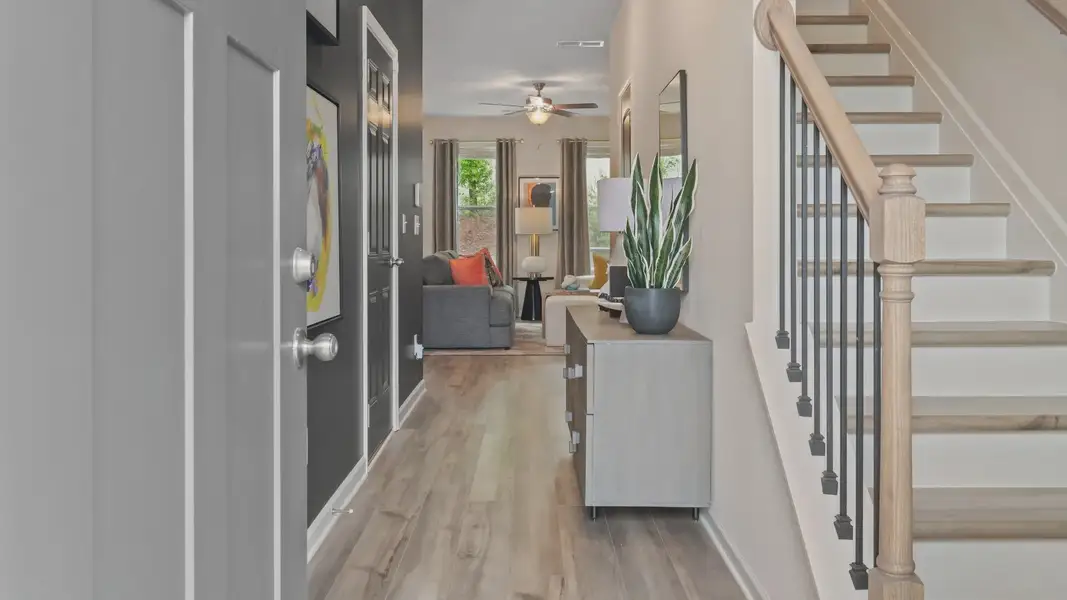 Entryway into the home with access to staircase