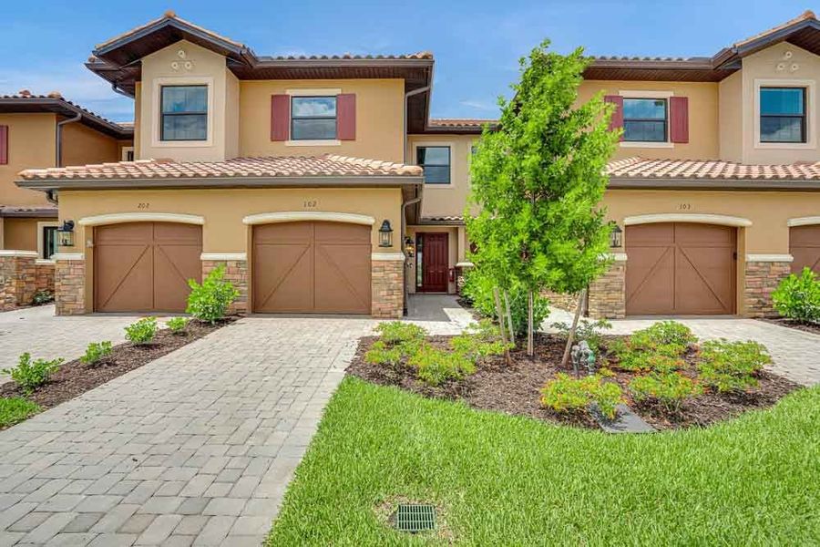 Exterior details and patio area of a home in Esplanade by the Islands Coach Homes, Naples (Image 2). Exterior details and patio area of a home in Esplanade by the Islands Coach Homes, Naples (Image 2).