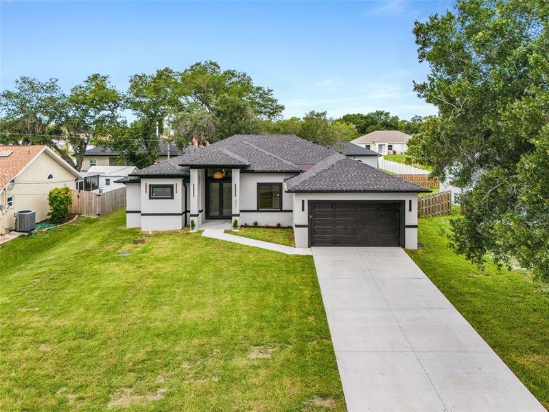 Front exterior of a new home in , Port Charlotte, FL, highlighting curb appeal (Image 17).