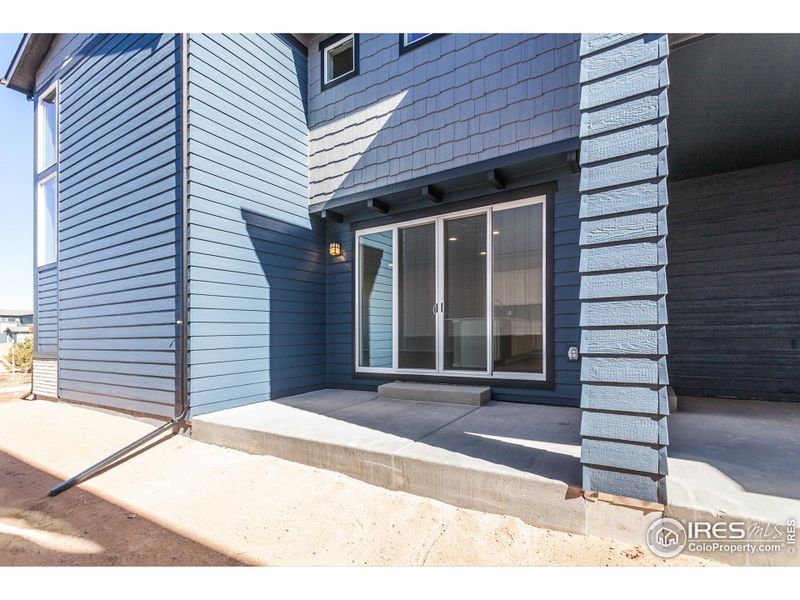 Front exterior of a new home in Trailside Alley Load - Single Family Homes, Timnath, CO, highlighting curb appeal (Image 22).