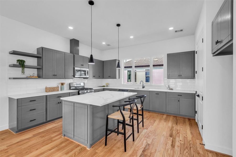 This modern kitchen combines ample storage with generous counter space, creating an ideal setting for culinary creativity and functionality. This modern kitchen combines ample storage with generous counter space, creating an ideal setting for culinary creativity and functionality.