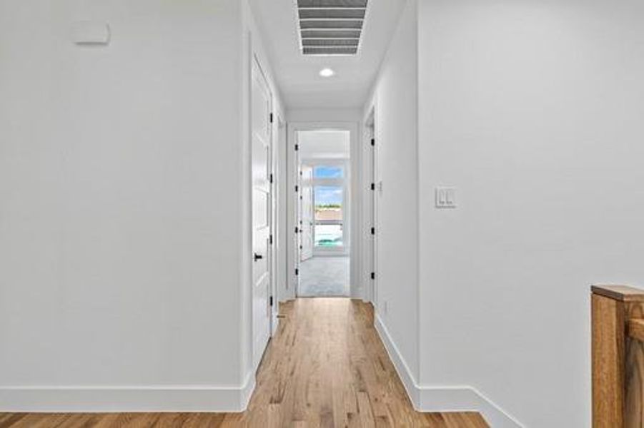 Corridor featuring light hardwood / wood-style flooring