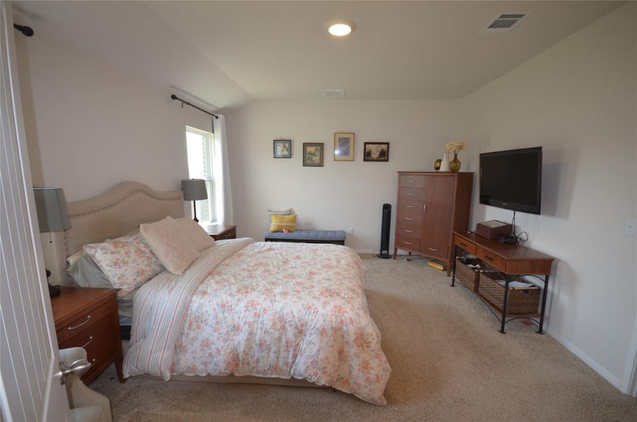 Bedroom with light carpet and baseboards Bedroom with light carpet and baseboards