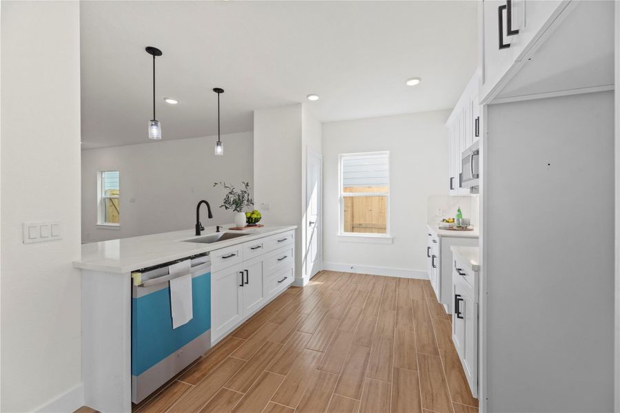 Designed to suit modern tastes and design preferences, the kitchen features stainless-steel appliances and stunning quartz countertops. Designed to suit modern tastes and design preferences, the kitchen features stainless-steel appliances and stunning quartz countertops.