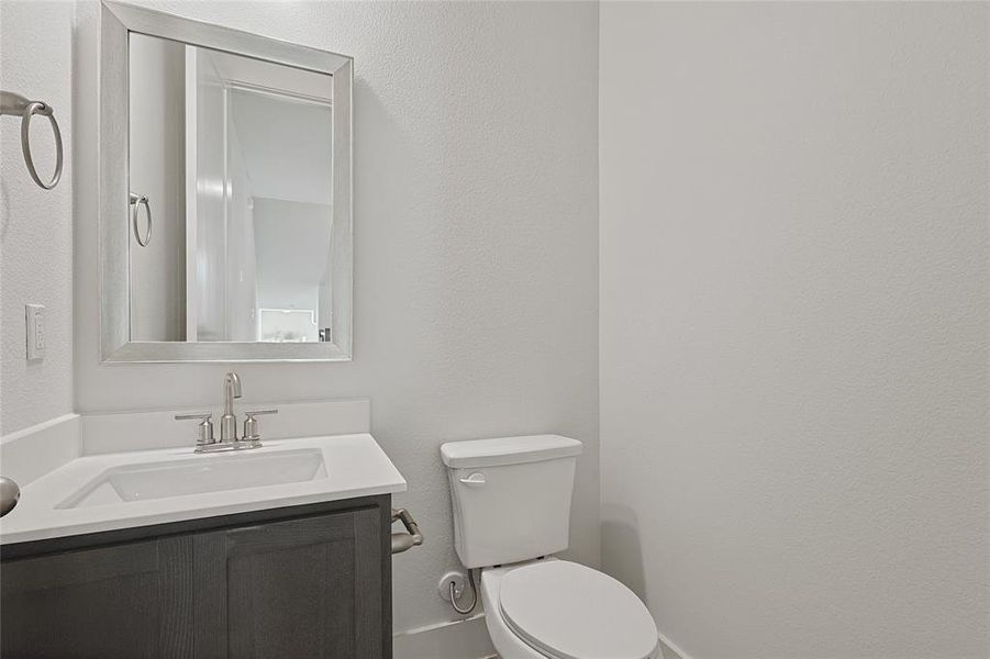 Bathroom with vanity and toilet