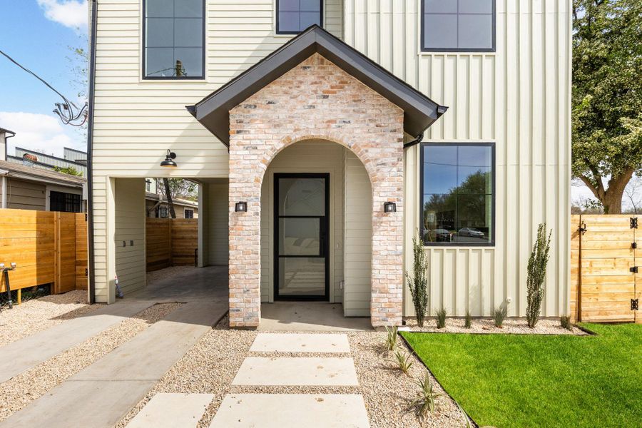 Doorway to property with board and batten siding Doorway to property with board and batten siding