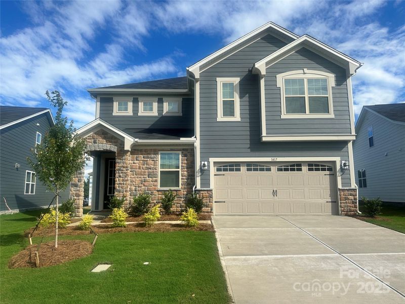 Front exterior of a new home in Waxhaw Landing, Monroe, NC, highlighting curb appeal (Image 14).