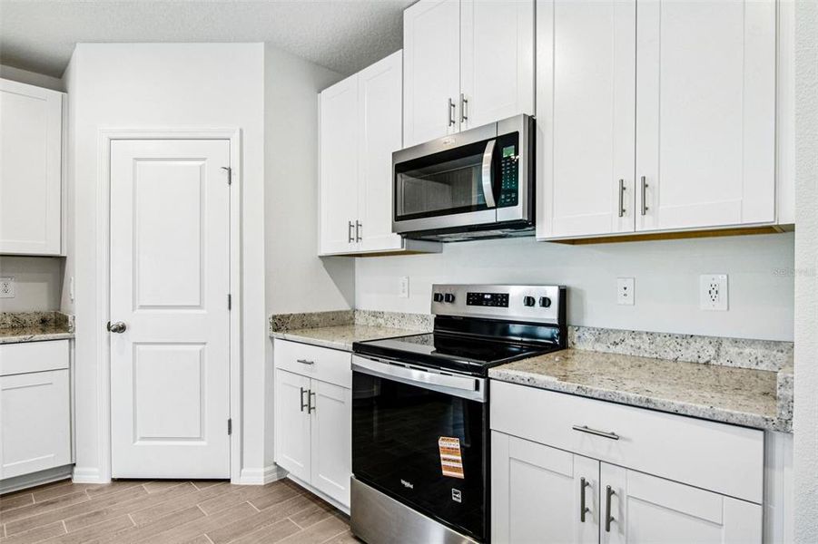 Furnished interior view inside a new home in Two Rivers - Classic Series, Zephyrhills (Image 4).