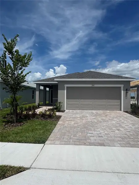 Front exterior of a new home in Willowbrook North, Winter Haven, FL, highlighting curb appeal (Image 1). Front exterior of a new home in Willowbrook North, Winter Haven, FL, highlighting curb appeal (Image 1).