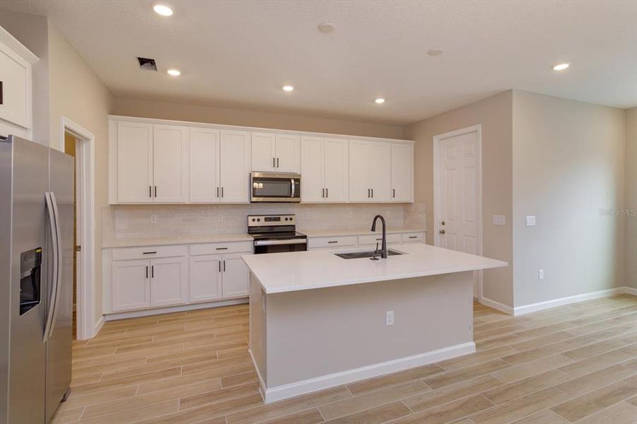 Furnished interior view inside a new home in Serenade at Ovation, Winter Garden (Image 11).