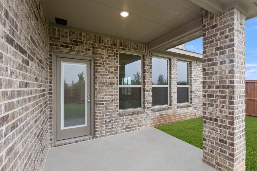 Front exterior of a new home in Redden Farms, Midlothian, TX, highlighting curb appeal (Image 29). Front exterior of a new home in Redden Farms, Midlothian, TX, highlighting curb appeal (Image 29).