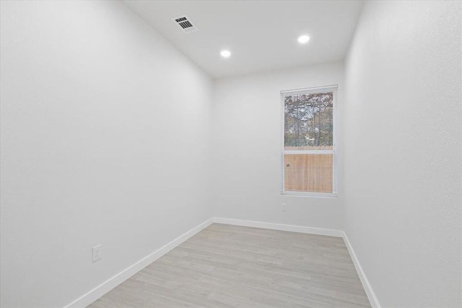 Spare room featuring light hardwood / wood-style floors