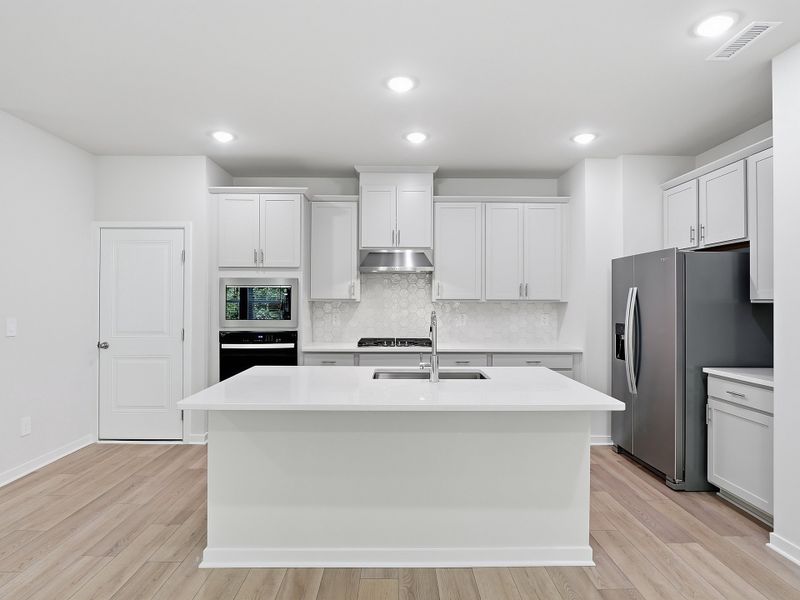 Furnished interior view inside a new home in Country Lane - Classic Series, Clayton (Image 3).