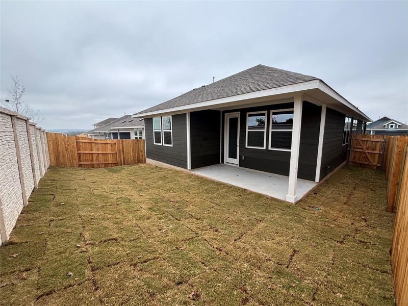 Exterior details and patio area of a home in Cannon Ranch 40s, Dripping Springs (Image 20).