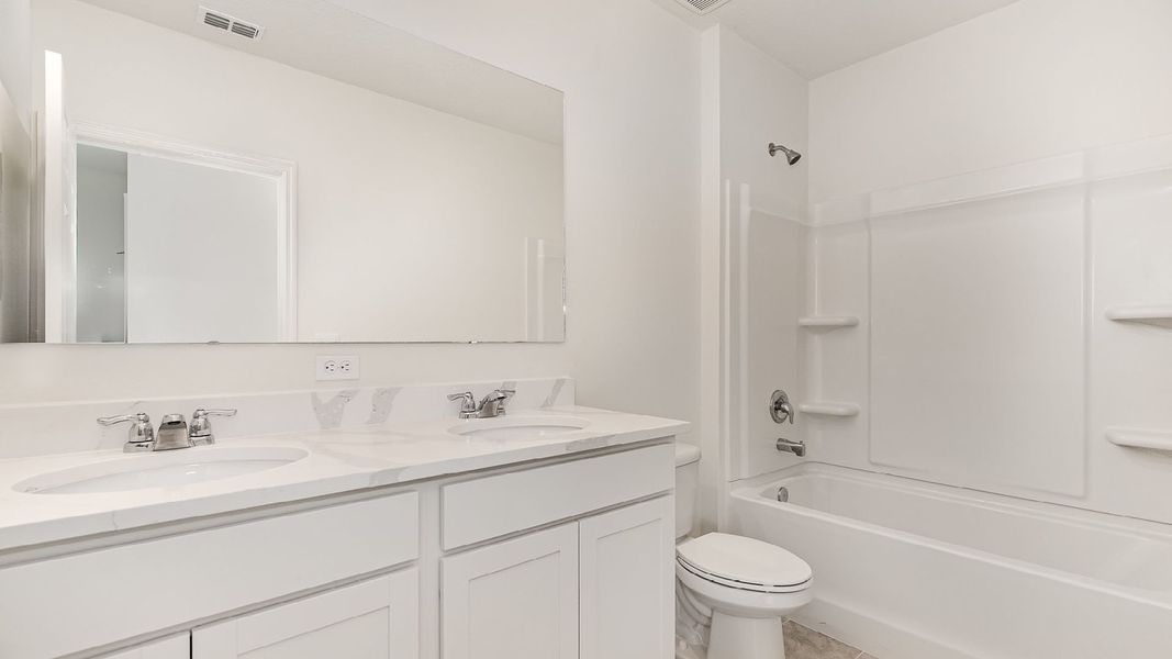 Representative furnished interior of a home built from the Hayden by D.R. Horton in Morningside, Fort Pierce (Image 8).
