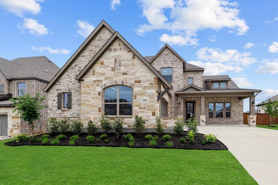 Front exterior of a new home in South Pointe  Village Series, Mansfield, TX, highlighting curb appeal (Image 2).