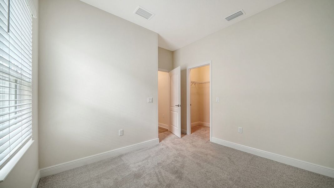 Spacious, unfurnished interior of a new home in Wildleaf at North River Ranch, Parrish (Image 23).