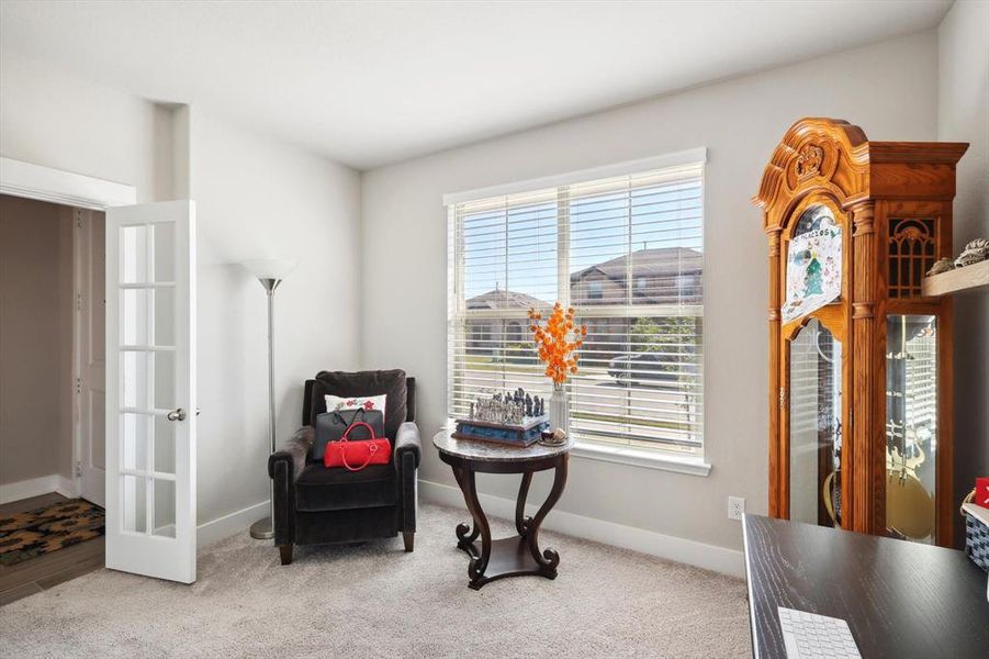 Sitting room featuring carpet flooring