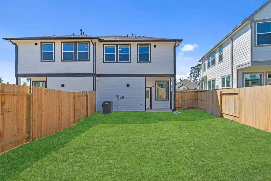 Exterior details and patio area of a home in Woodforest, Montgomery (Image 4).