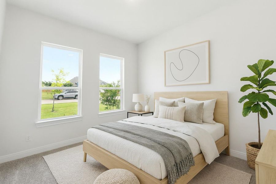 A well-lit bedroom with two generous windows and plush carpeting for ultimate comfort. A well-lit bedroom with two generous windows and plush carpeting for ultimate comfort.