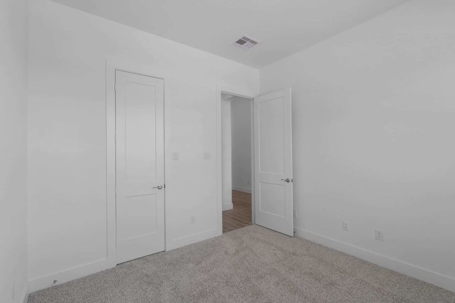 Representative unfurnished interior of a home built from the Mickelson by Chesmar Homes in Riceland Alley Loads, Mont Belvieu (Image 84).