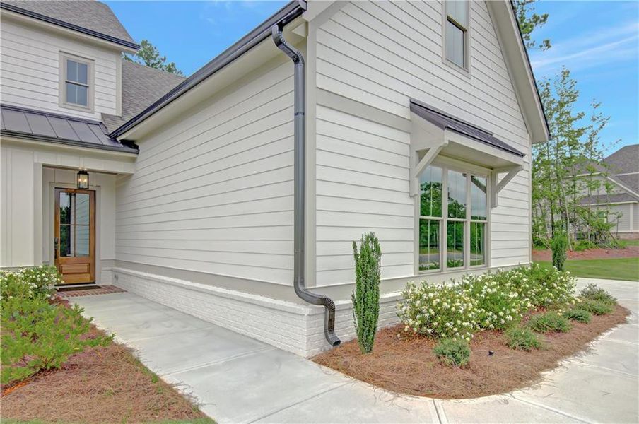Front exterior of a new home in , Newnan, GA, highlighting curb appeal (Image 26). Front exterior of a new home in , Newnan, GA, highlighting curb appeal (Image 26).