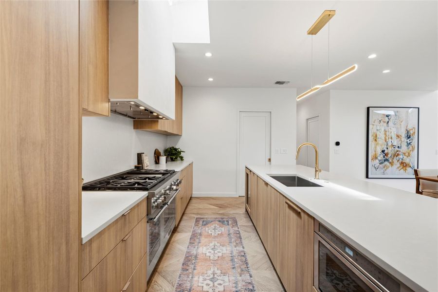 White oak cabinetry and stainless steel appliances