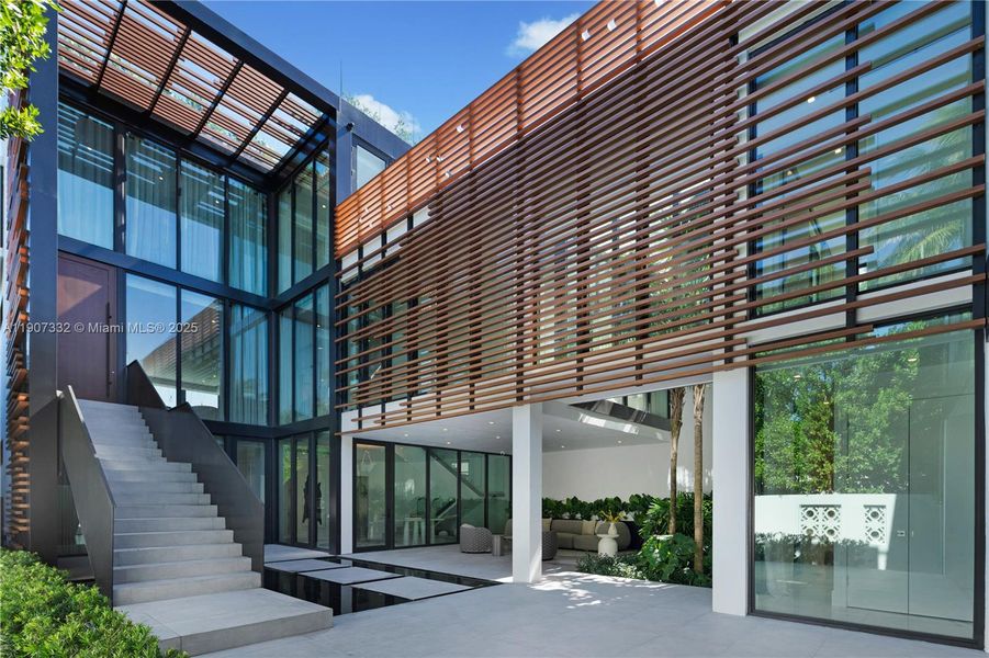 Exterior details and patio area of a home in , Miami Beach (Image 26). Exterior details and patio area of a home in , Miami Beach (Image 26).