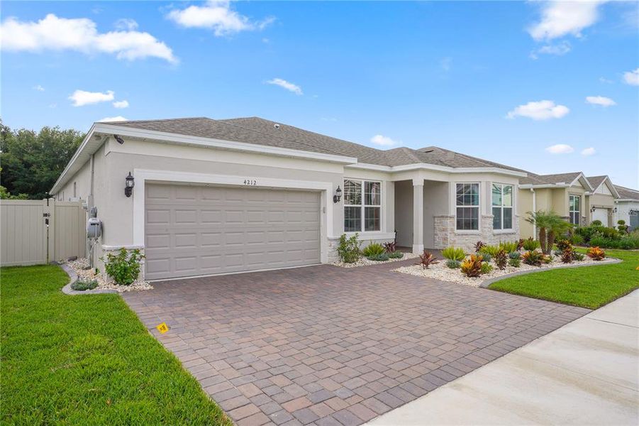 Front exterior of a new home in Winding Meadows, Apopka, FL, highlighting curb appeal (Image 26).