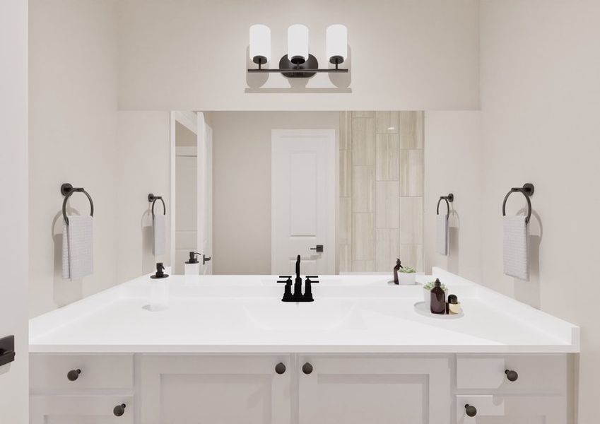 Sleek bathroom with a bright white vanity, black fixtures, and modern lighting. Twin towel rings hold folded towels, creating a minimalistic ambiance.