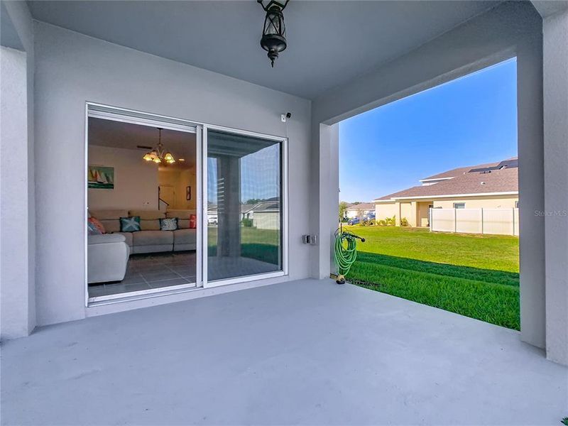 Exterior details and patio area of a home in Horse Creek at Crosswinds, Davenport (Image 23).