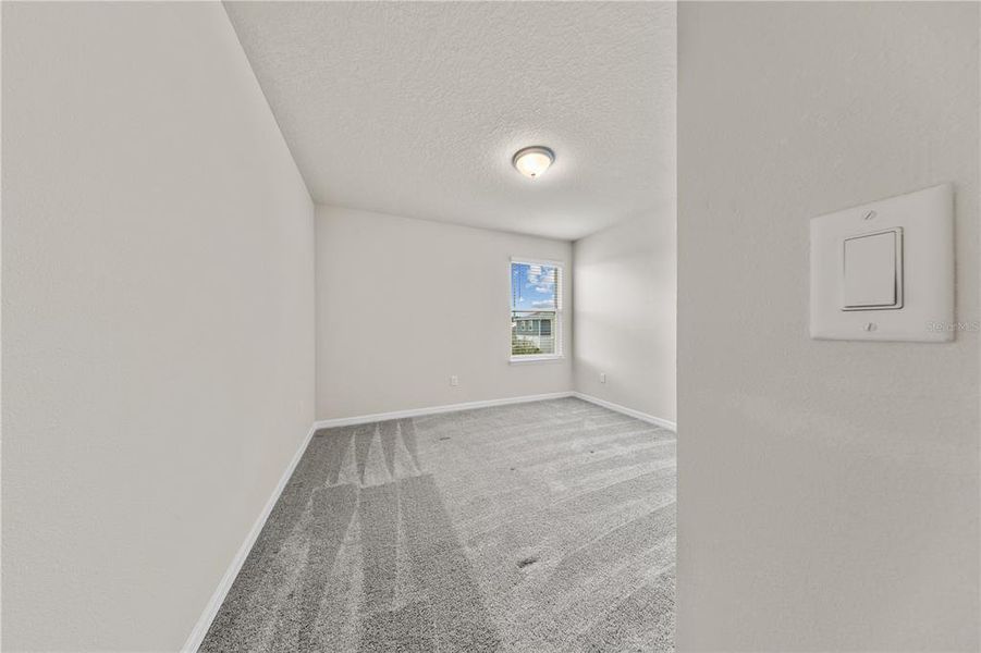 Spacious, unfurnished interior of a new home in EverBe, Orlando (Image 35).
