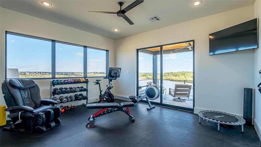 Exercise room featuring ceiling fan