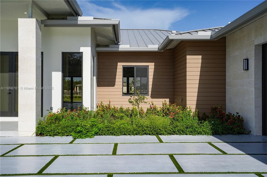 Front exterior of a new home in , Homestead, FL, highlighting curb appeal (Image 28).