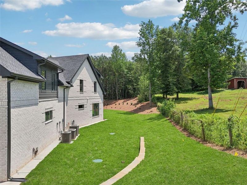 Front exterior of a new home in , Braselton, GA, highlighting curb appeal (Image 33). Front exterior of a new home in , Braselton, GA, highlighting curb appeal (Image 33).