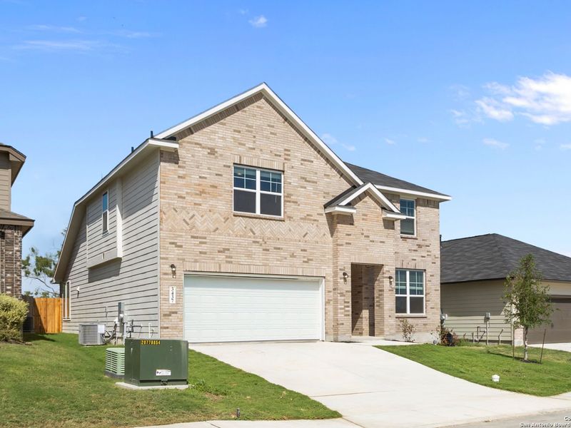 Front exterior of a new home in Horizon Pointe, Converse, TX, highlighting curb appeal (Image 2). Front exterior of a new home in Horizon Pointe, Converse, TX, highlighting curb appeal (Image 2).