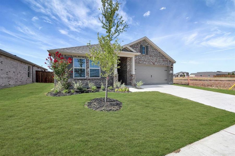 Front exterior of a new home in Mobberly Farms, Pilot Point, TX, highlighting curb appeal (Image 17).