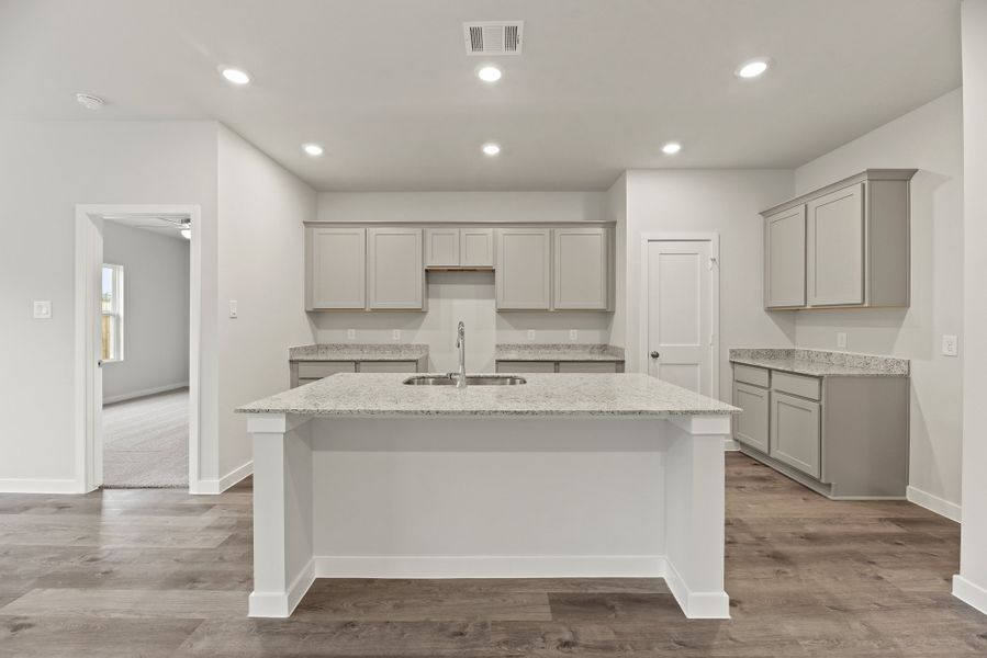 A kitchen with white cabinets. A kitchen with white cabinets.