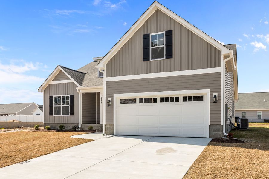 Front exterior of a new home in Davenport Farms, Winterville, NC, highlighting curb appeal (Image 20).