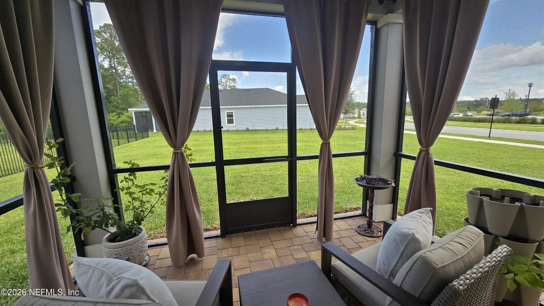 Exterior details and patio area of a home in Edenbrooke at Hyland Trail | 55+, Green Cove Springs (Image 25).